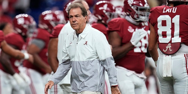 Alabama coach Nick Saban watches players warm up for the College Football Playoff national championship game against Georgia Jan. 10, 2022, in Indianapolis.