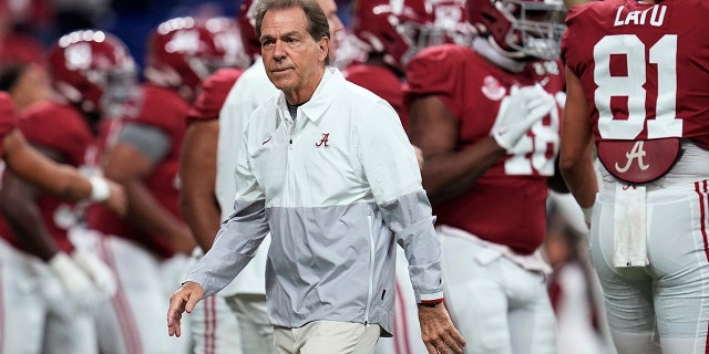 FILE - Alabama coach Nick Saban watches players warm up for the College Football Playoff championship NCAA football game against Georgia on Jan. 10, 2022, in Indianapolis.