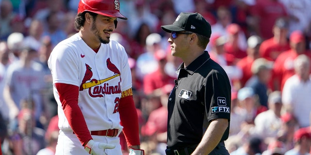 St. Louis Cardinals' Nolan Arenado, left, quarrels with referee crew chief Mark Wegner after being ousted during the eighth round of a baseball game against the New York Mets on Wednesday, April 27, 2022 in St. Louis. Louis.