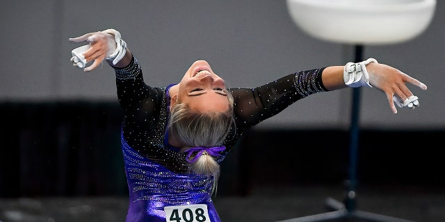 Apr 16, 2021; Fort Worth, Texas, USA; LSU Tigers freshman gymnast Olivia Dunne performs on the uneven bars during the 2021 NCAA Women Gymnastics Championships at Dickies Arena.