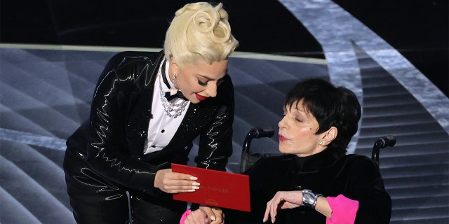 Lady Gaga and Liza Minnelli speak onstage during the 94th Annual Academy Awards at Dolby Theater on March 27, 2022, in Hollywood. "I gotcha," said Lady Gaga to Liza Minnelli as the latter appeared to struggle.