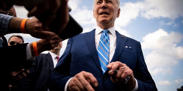 U.S. President Biden speaks to reporters while departing at Des Moines International Airport in Des Moines, Iowa, U.S., April 12, 2022. 