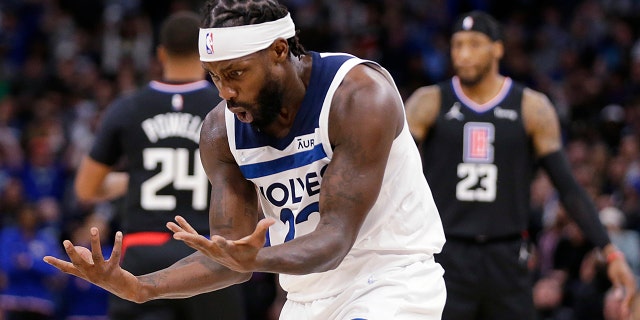 Minnesota Timberwolves guard Patrick Beverley (22) looks at his hands after a foul call against the Los Angeles Clippers during the first quarter during an NBA basketball game Tuesday, April 12, 2022, in Minneapolis.