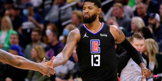 Los Angeles Clippers guard Paul George celebrates during the fourth quarter of the team's play-in game against the Minnesota Timberwolves Tuesday, April 12, 2022, in Minneapolis.