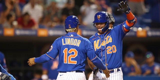 New York Mets first baseman Pete Alonso (20) celebrates his game-tying homer with shortstop Francisco Lindor (12) during a game against the Houston Astros March 30, 2022, at Clover Park in Port Saint Lucie, Fla.
