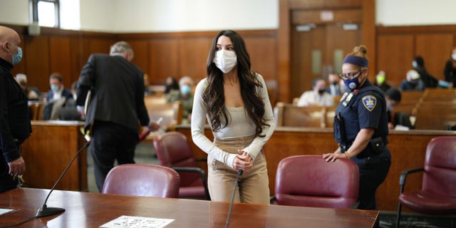 Miya Ponsetto stands at her hearing