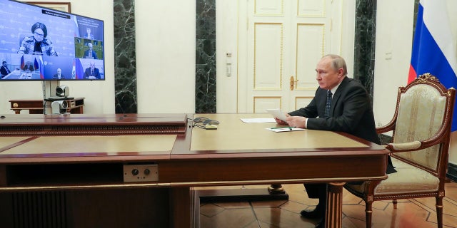 Russian President Vladimir Putin chairs a meeting on economic issues via a video link in Moscow, Russia, on Monday, April 25.