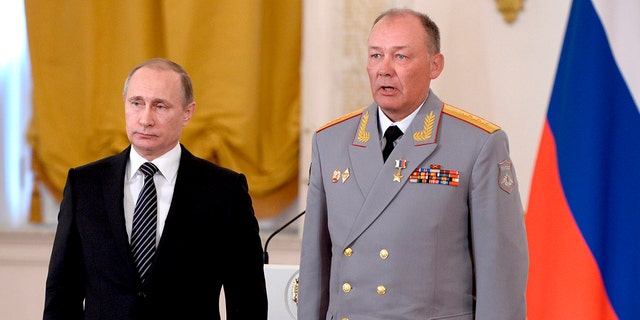 In this photo taken on March 17, 2016, Russian President Vladimir Putin, left, poses with Col. Gen. Alexander Dvornikov during an awarding ceremony in Moscow's Kremlin, Russia. Russia has appointed a new Ukraine war commander. A top U.S. official on Sunday, April 10, 2022 said Russia named Gen. Dvornikov as commander of an armed campaign that Russian authorities still refer to as a "special military operation."