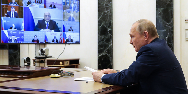 Russian President Vladimir Putin attends a meeting on the current situation of the Russian steel industry via video conference at the Kremlin in Moscow, Russia on Wednesday.