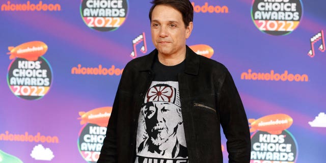 Macchio paid tribute to "Karate Kid" almost four decades after the movie was released by wearing a Mr. Miyagi shirt on the orange carpet.