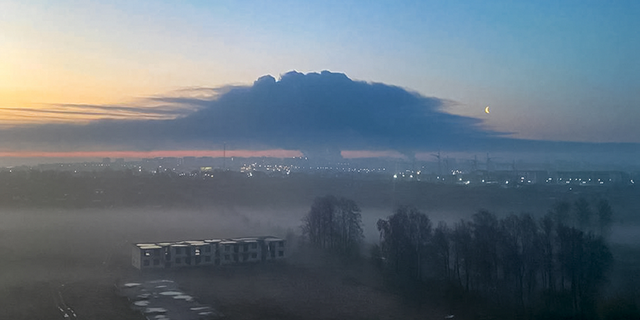 Smoke rises into the sky during the fire in Bryansk, Russia, on Monday, April 25.