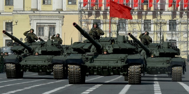 Russian military vehicles move on Dvortsovaya Square during a rehearsal for the Victory Day military parade in Saint Petersburg on April 28, 2022. Russia will celebrate the 77th anniversary of the 1945 victory over Nazi Germany on May 9. (Photo by OLGA MALTSEVA/AFP via Getty Images)