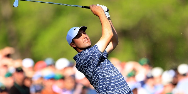 Scottie Scheffler plays his shot from the 12th tee during the final round of the Masters at Augusta National Golf Club on April 10, 2022 in Augusta, Georgia.