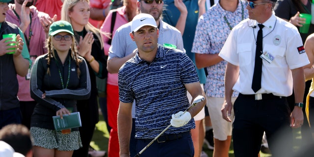 AUGUSTA, GEORGIA - APRIL 10: Scottie Scheffler lines up a shot on the ninth hole during the final round of the Masters at Augusta National Golf Club on April 10, 2022 in Augusta, Georgia.