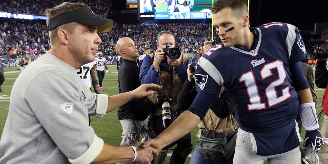 Head coach Sean Payton of the New Orleans Saints shakes hands with quarterback Tom Brady of the New England Patriots following the Patriots 30-27 win at Gillette Stadium on Oct. 13, 2013 in Foxboro, Massachusetts.