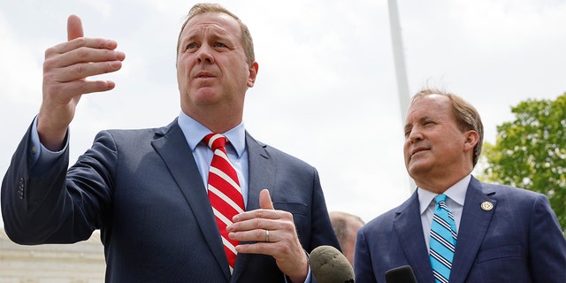 As attorney general, Schmitt, left, led a first-of-its-kind lawsuit against the Biden administration, alleging collusion with Big Tech platforms to suppress speech.