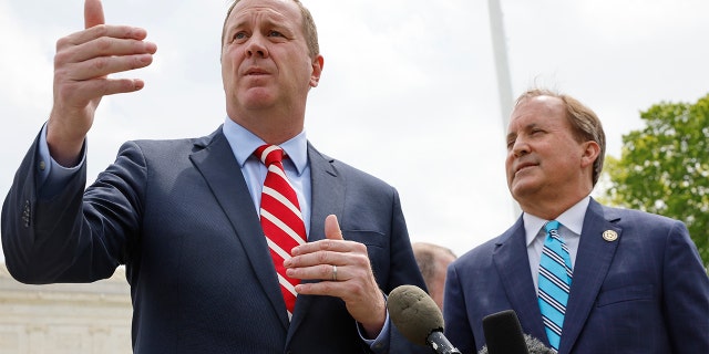 As attorney general, Schmitt, left, led a first-of-its-kind lawsuit against the Biden administration, alleging collusion with Big Tech platforms to suppress speech.