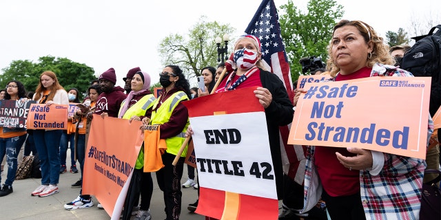 Immigration activists demonstrate in front of the U.S. Supreme Court in Washington on Tuesday, April 26, 2022, as the Supreme Court hears oral arguments in the Biden v. Texas case.