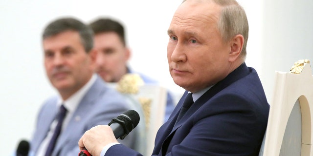 Russian President Vladimir Putin looks on as he holds a meeting of the Russia - Land of Opportunity platform supervisory board at the Catherine's Hall of the Kremlin in Moscow on April 20, 2022.