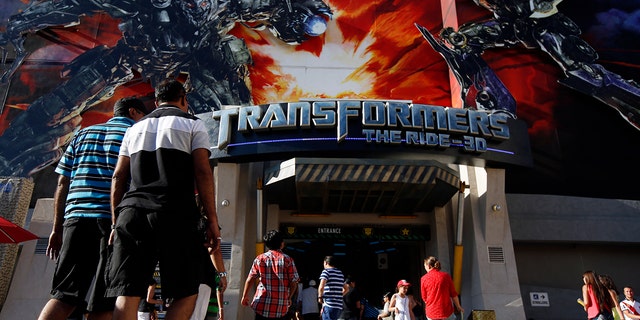 Visitors enter "Transformers: The Ride-3D" at the Universal Studios Hollywood theme park in Hollywood, California, U.S., on Thursday, Aug. 15, 2013. 