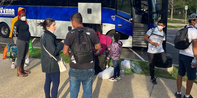 A third bus of migrants who crossed the U.S. border into Texas arrived in Washington, D.C., near the U.S. Capitol, Friday, April 15, 2022.