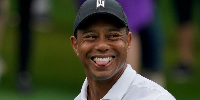 Tiger Woods walks on the 15th fairway during a practice round for the Masters golf tournament Wednesday, April 6, 2022, in Augusta, Ga.