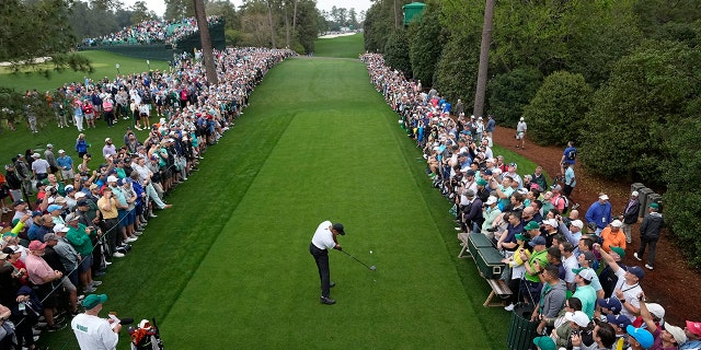 Tiger Woods tees off at the 18th hole during a practice round for the Masters golf tournament Wednesday, April 6, 2022, in Augusta, Ga.