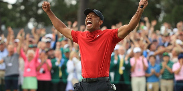 Tiger Woods celebrates after winning the Masters on April 14, 2019.