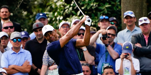 Tiger Woods tees off on the seventh hole during a practice round for The Masters golf tournament on Monday, April 4, 2022, in Augusta, Georgia.