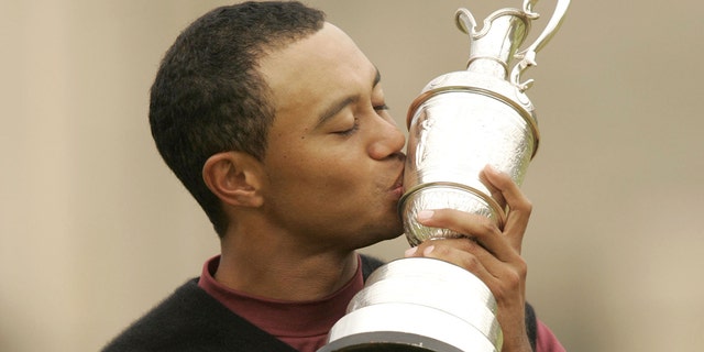 Tiger Woods kisses the Claret Jug after winning the 2005 British Open Golf Championship at the Royal and Ancient Golf Club in St. Andrews, Scotland July 17, 2005.