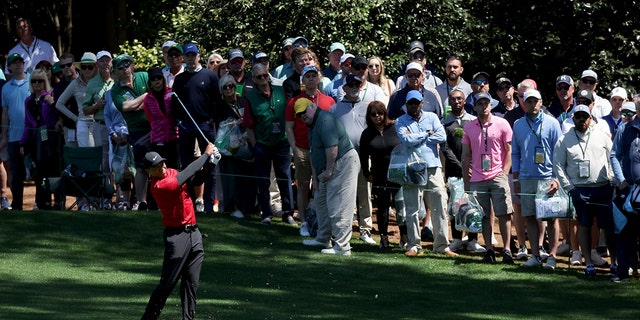 Tiger Woods plays his shot on the 10th hole during the final round of the Masters at Augusta National Golf Club on April 10, 2022 in Augusta, Georgia.