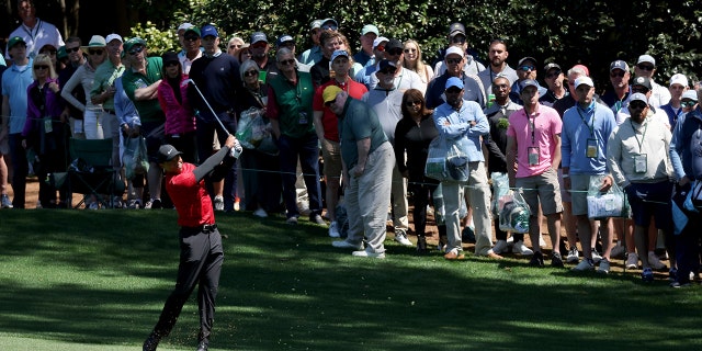 Tiger Woods plays his shot on the 10th hole during the final round of the Masters at Augusta National Golf Club on April 10, 2022 in Augusta, Georgia.