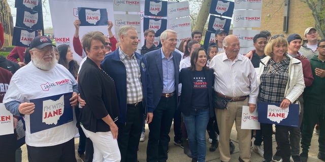Sen. Rob Portman R-Ohio, and Ohio GOP Senate candidate Jane Timken pose with volunteers at Timken's campaign headquarters on April 30, 2022. (Tyler Olson/Fox News)