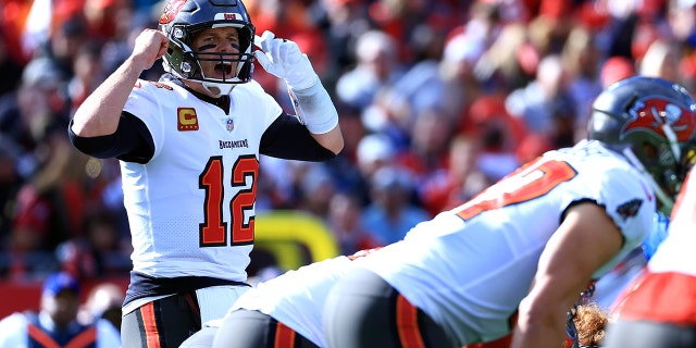 Tom Brady #12 of the Tampa Bay Buccaneers reacts at the line of scrimmage during the first half against the Los Angeles Rams in the NFC Divisional Playoff game at Raymond James Stadium on January 23, 2022 in Tampa, Florida.