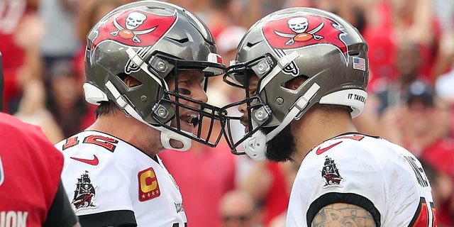 Tampa Bay Buccaneers quarterback Tom Brady (12) congratulates wide receiver Mike Evans (13) after scoring a touchdown during the regular season game between the Atlanta Falcons and Tampa Bay Buccaneers on 19 September 2021 at Raymond James Stadium in Tampa, Florida.