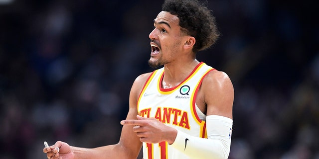 Atlanta Hawks guard Trae Young reacts to a foul call during the first half of the team's NBA play-in game against the Cleveland Cavaliers April 15, 2022, in Cleveland.
