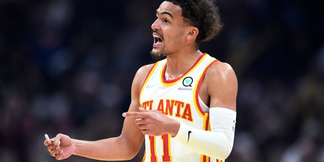 Atlanta Hawks guard Trae Young reacts to a foul call during the first half of the team's NBA play-in game against the Cleveland Cavaliers April 15, 2022, in Cleveland.