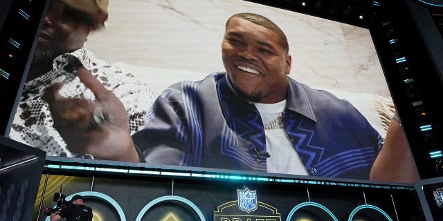 Travon Walker reacts after being selected as the first pick during the 2022 NFL Draft April 28, 2022, in Las Vegas.