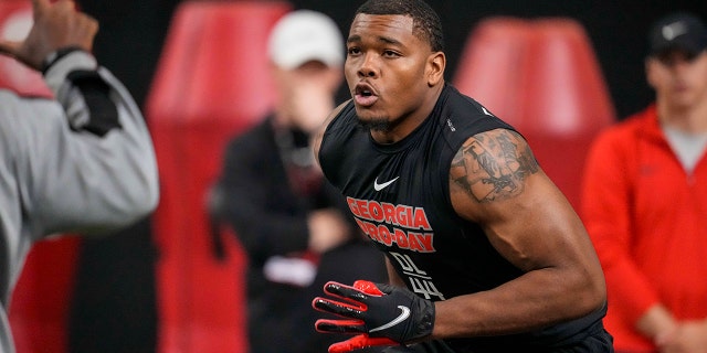 Georgia Bulldogs defensive lineman Travon Walker runs in a drill on March 16, 2022, in Atlanta.