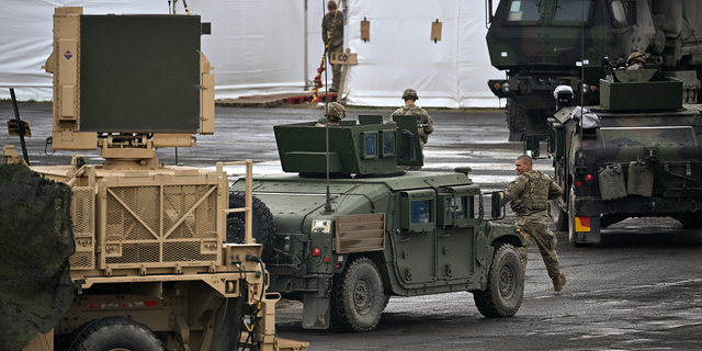 U.S. Soldiers from the 82nd Airborne take part in an exercise outside the operating base at the Arlamow Airport on Tuesday in Wola Korzeniecka, Poland.