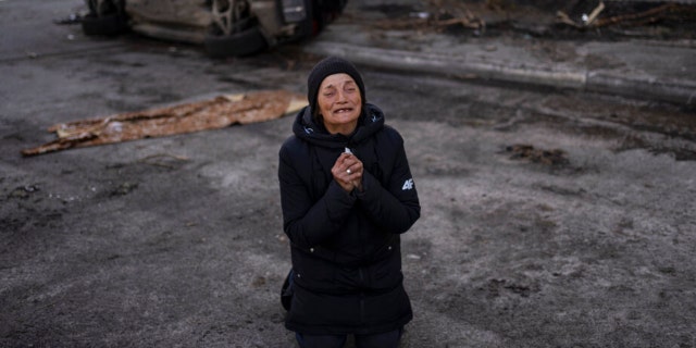Tanya Nedashkivs'ka, 57, mourns the death of her husband, killed in Bucha, on the outskirts of Kyiv, Ukraine, Monday, April 4, 2022. Russia is facing a fresh wave of condemnation after evidence emerged of what appeared to be deliberate killings of civilians in Ukraine.