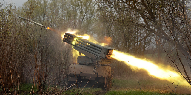 Ukrainian servicemen fire a BM-21 Grad multiple rocket launch system on Wednesday in the Kharkiv region.