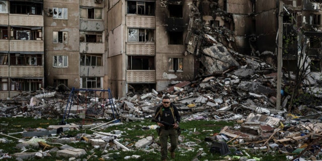 A Ukrainian serviceman walks amid the rubble of a building heavily damaged by multiple Russian bombardments near a frontline in Kharkiv, Ukraine, on April 25.