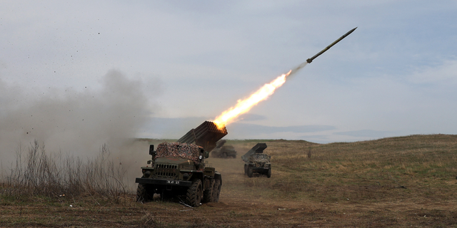 A Ukrainian multiple rocket launcher BM-21 "Grad" shells a Russian troop position near Luhansk in the Donbas region on Sunday.