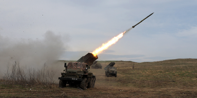 A Ukrainian multiple rocket launcher BM-21 "Grad" shells a Russian troop position near Luhansk in the Donbas region on Sunday.