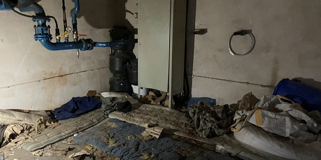 Dirty mattresses are seen on a cement floor of a factory room where Russian troops held Red Cross volunteers Volodymyr Khropun and Yulia Ivannikova-Katsemon together with dozens of other locals in the village of Dymer, Ukraine.