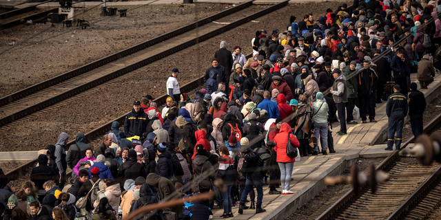 Families wait to board a train at Kramatorsk central station as they flee the eastern city of Kramatorsk, in the Donbas region, in early April.