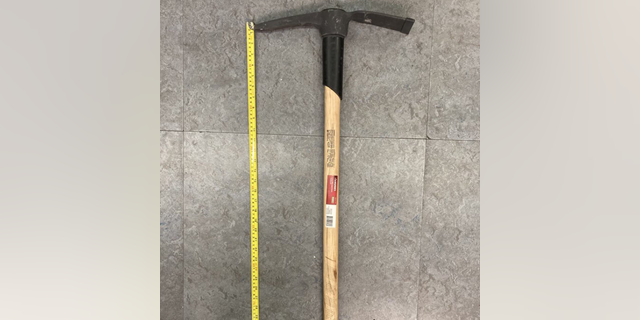 New York City police officers have arrested a man who was allegedly "swinging an axe" while on the A-train.