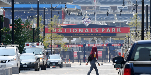 A pedestrian walks near Nationals Park on Tuesday July 20, 2021 in Washington, DC.