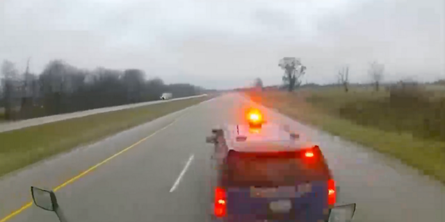Police said the semi-truck was on I-94 in Paw Paw, Michigan when it hit the Michigan State Police trooper's car from behind while its emergency lights were on, according to Fox 2 Detroit.
